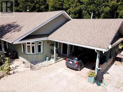 Now let's enter from the covered entry in the carport to have a closer look inside. - 61 North Shore Road, Northern Bruce Peninsula, ON - Outdoor