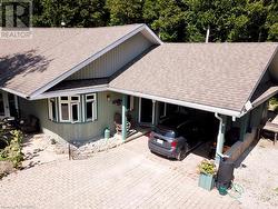 Now let's enter from the covered entry in the carport to have a closer look inside. - 