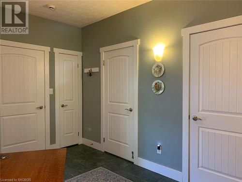 Foyer entry area offers plenty of storage areas including large closet, linen closet, laundry room and mechanical/workshop room. - 61 North Shore Road, Northern Bruce Peninsula, ON - Indoor Photo Showing Other Room