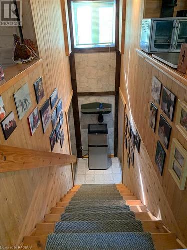 Interior staircase to lower level garage area access. - 61 North Shore Road, Northern Bruce Peninsula, ON - Indoor Photo Showing Other Room