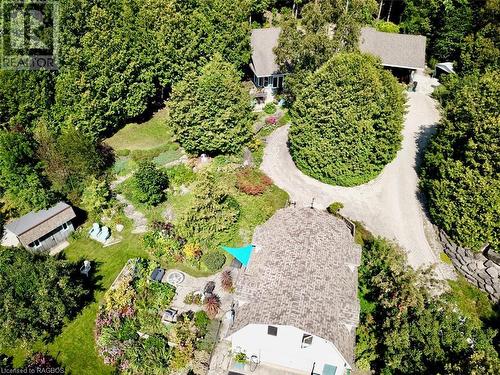 Manicured grounds throughout the front of the home and a circular drive. - 61 North Shore Road, Northern Bruce Peninsula, ON - Outdoor