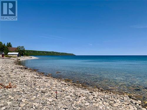 Discover Georgian Bay waters and views at access shoreline area. - 61 North Shore Road, Northern Bruce Peninsula, ON - Outdoor With Body Of Water With View