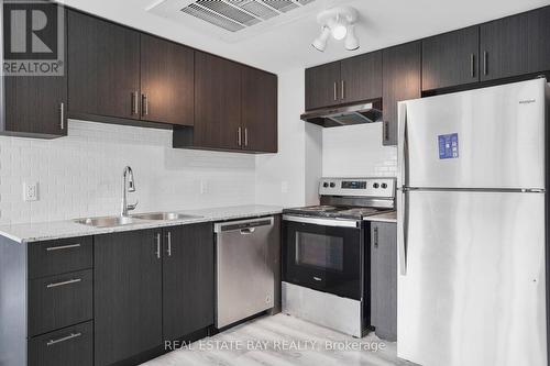 #H404 -275 Larch St, Waterloo, ON - Indoor Photo Showing Kitchen With Stainless Steel Kitchen With Double Sink