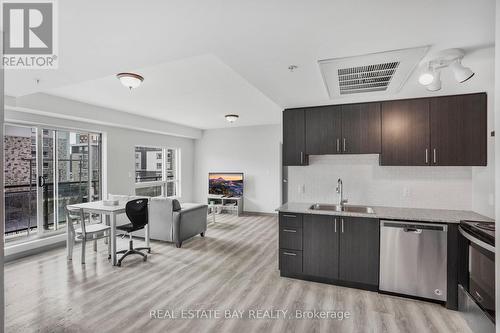 #H404 -275 Larch St, Waterloo, ON - Indoor Photo Showing Kitchen With Stainless Steel Kitchen