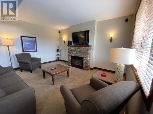 600 Bighorn Boulevard Unit# 633D, Radium Hot Springs, BC - Indoor Photo Showing Living Room With Fireplace