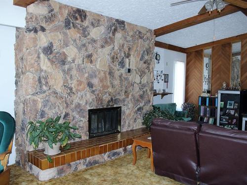 219 Second Street, Rainy River, ON - Indoor Photo Showing Living Room With Fireplace
