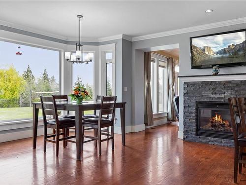 2710 Clover Close, Nanaimo, BC - Indoor Photo Showing Dining Room With Fireplace