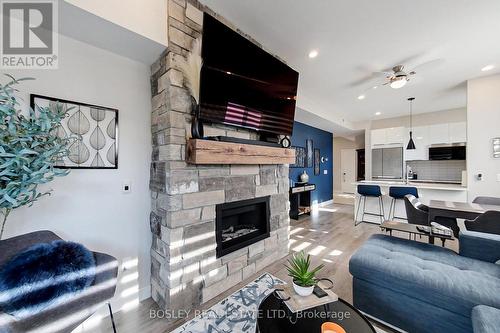 #102 -10 Beausoleil Lane, Blue Mountains, ON - Indoor Photo Showing Living Room With Fireplace