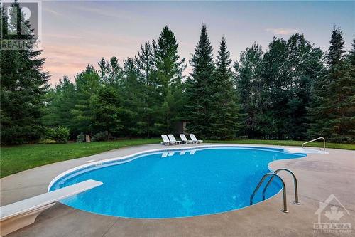 5800 Queenscourt Crescent, Ottawa, ON - Outdoor With In Ground Pool With Backyard