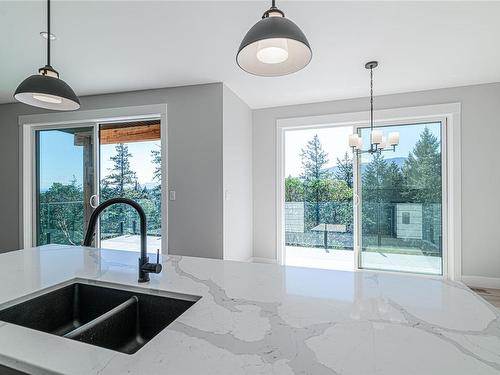 106-1217 Manzanita Pl, Nanaimo, BC - Indoor Photo Showing Kitchen With Double Sink