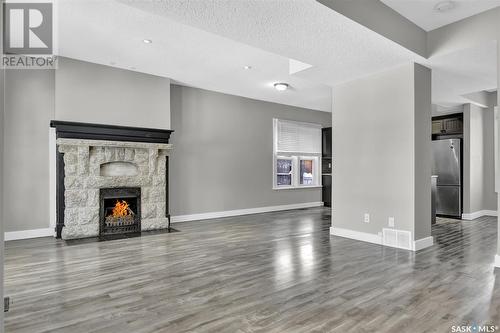 2059 Elphinstone Street, Regina, SK - Indoor Photo Showing Other Room With Fireplace