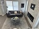6 115 Feheregyhazi Boulevard, Saskatoon, SK  - Indoor Photo Showing Living Room With Fireplace 