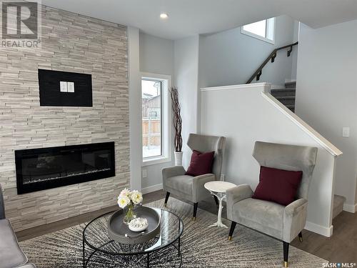 6 115 Feheregyhazi Boulevard, Saskatoon, SK - Indoor Photo Showing Living Room With Fireplace