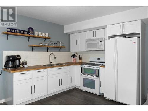 145 Magic Drive, Kelowna, BC - Indoor Photo Showing Kitchen With Double Sink