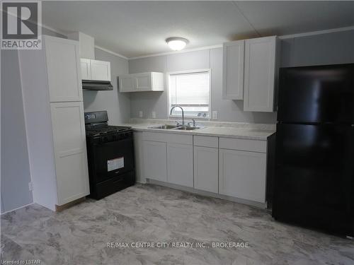 #128 -198 Springbank Dr, London, ON - Indoor Photo Showing Kitchen With Double Sink