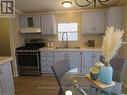 #120 -198 Springbank Dr, London, ON  - Indoor Photo Showing Kitchen With Double Sink 