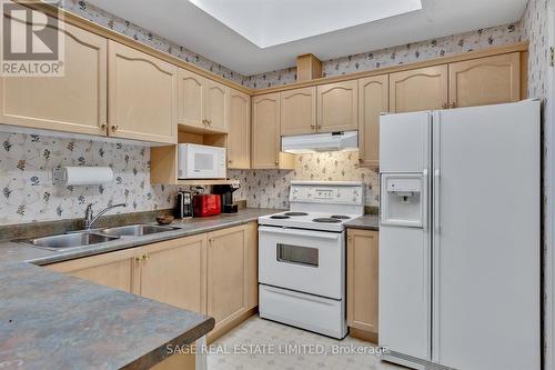 2 - 21 Charles Court, Smith-Ennismore-Lakefield, ON - Indoor Photo Showing Kitchen With Double Sink