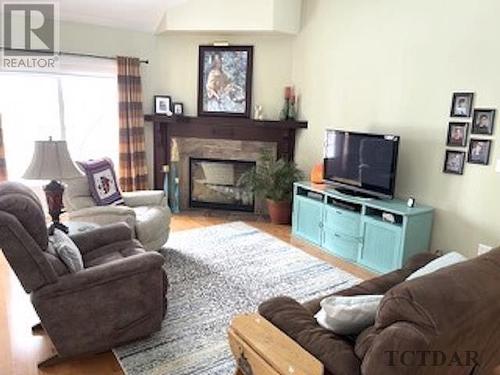883128 Highway 65 E, Temiskaming Shores, ON - Indoor Photo Showing Living Room With Fireplace