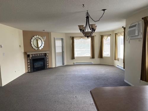 202 - 7129 Riverside Drive, Grand Forks, BC - Indoor With Fireplace