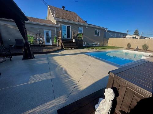 Back facade - 59 Rue Beaudry, Rouyn-Noranda, QC - Outdoor With In Ground Pool