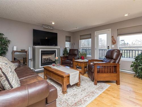 2214 Townsend Rd, Sooke, BC - Indoor Photo Showing Living Room With Fireplace