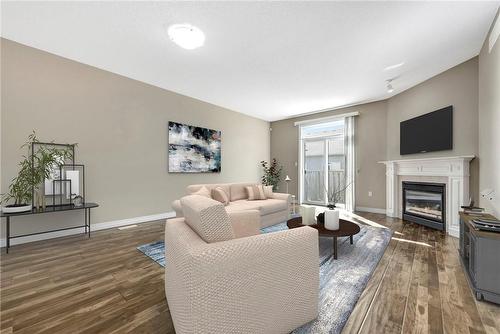 VIRTUALLY STAGED - 4 Mckinnell Lane, Binbrook, ON - Indoor Photo Showing Living Room With Fireplace