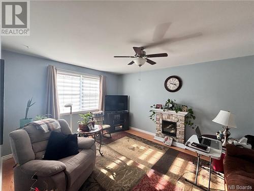 104 Water  South Street, Woodstock, NB - Indoor Photo Showing Living Room With Fireplace