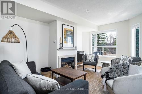 22 Cranberry Surf, Collingwood, ON - Indoor Photo Showing Living Room With Fireplace