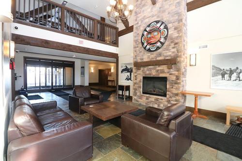 202A - 1420 Palliser Trail, Golden, BC - Indoor Photo Showing Living Room With Fireplace