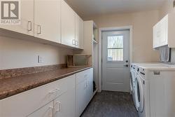 Main Floor laundry with access to deck - 