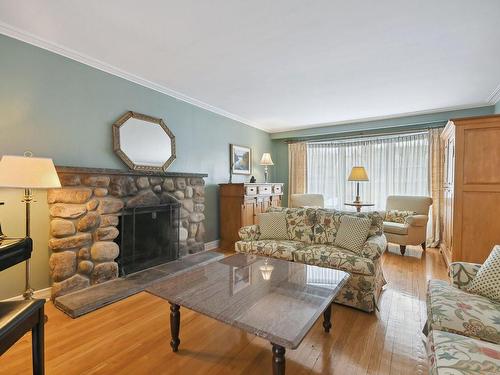 Living room - 114 Av. Astoria, Pointe-Claire, QC - Indoor Photo Showing Living Room With Fireplace