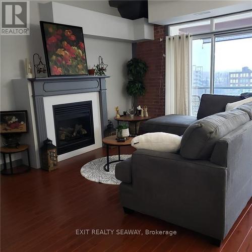 Bright Living Room - 710 Cotton Mill Street Unit#405, Cornwall, ON - Indoor Photo Showing Living Room With Fireplace