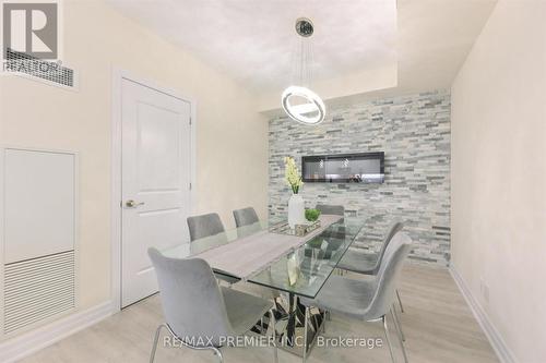 #1807 -9075 Jane St, Vaughan, ON - Indoor Photo Showing Dining Room With Fireplace