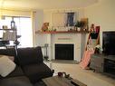 408-290 Regina Ave, Saanich, BC  - Indoor Photo Showing Living Room With Fireplace 