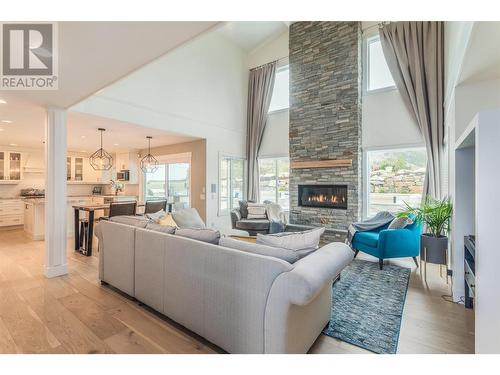 309 Tanager Drive, Kelowna, BC - Indoor Photo Showing Living Room With Fireplace