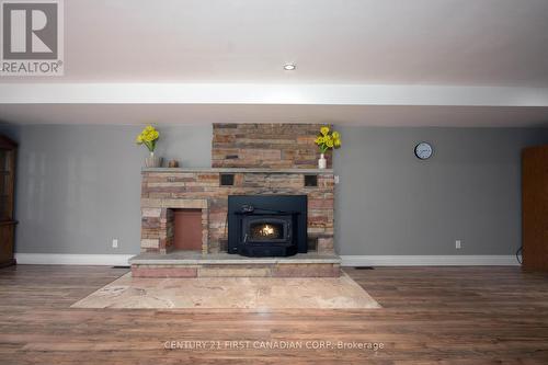 1835 Mark Settlement Drive, North Middlesex, ON - Indoor Photo Showing Other Room With Fireplace