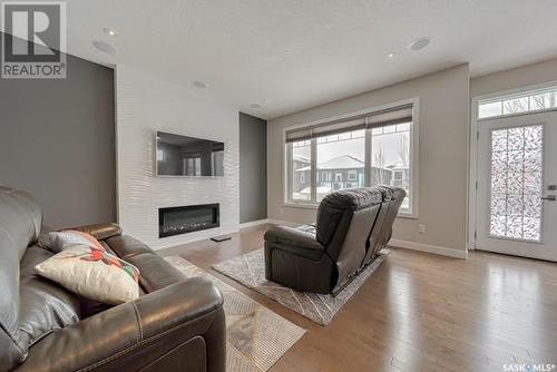 3961 Sandhill Crescent, Regina, SK - Indoor Photo Showing Living Room With Fireplace