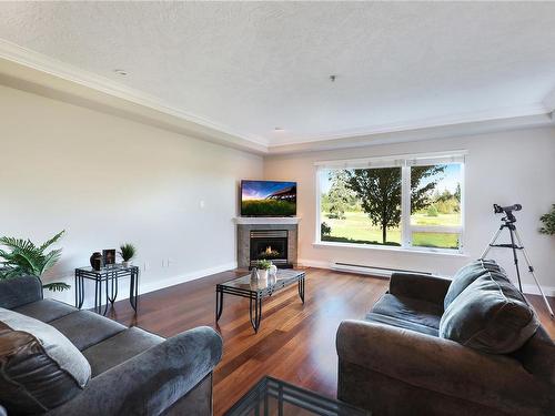 215-3666 Royal Vista Way, Courtenay, BC - Indoor Photo Showing Living Room With Fireplace