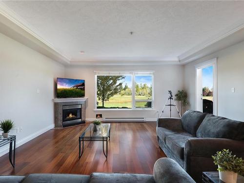 215-3666 Royal Vista Way, Courtenay, BC - Indoor Photo Showing Living Room With Fireplace