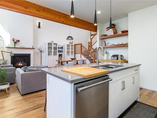 C-221 Glacier View Dr, Comox, BC - Indoor Photo Showing Kitchen With Fireplace With Double Sink