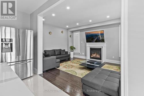 22 Travers Gate, Springwater, ON - Indoor Photo Showing Living Room With Fireplace