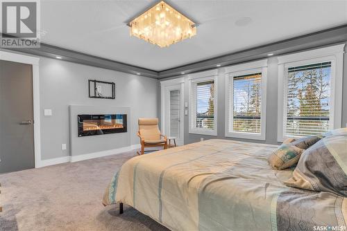 559 Atton Lane, Saskatoon, SK - Indoor Photo Showing Bedroom With Fireplace