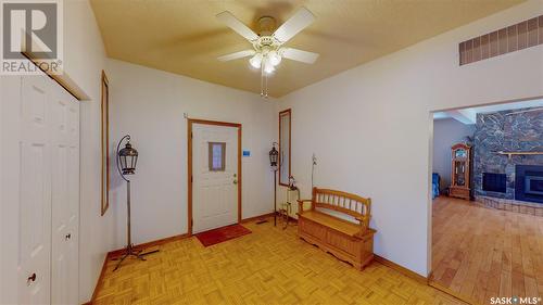749 Gibson Road, Balgonie, SK - Indoor Photo Showing Other Room With Fireplace