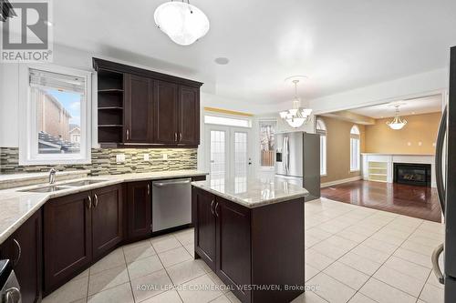 15 Quatro Crescent, Brampton, ON - Indoor Photo Showing Kitchen With Fireplace With Double Sink