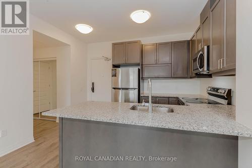303 - 95 Dundas Street W, Oakville, ON - Indoor Photo Showing Kitchen With Double Sink