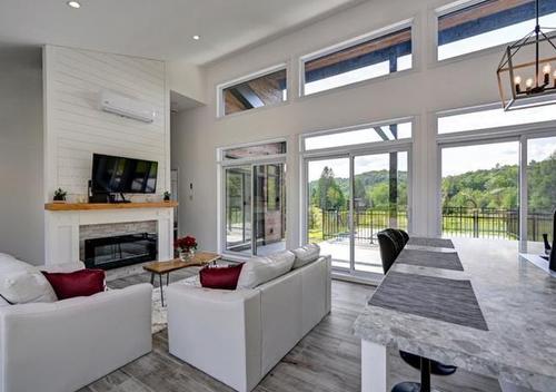 Living room - 7007 Rue Champlain, Wentworth-Nord, QC - Indoor Photo Showing Living Room With Fireplace