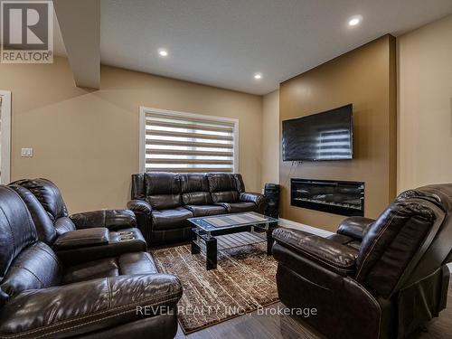 2911 Lemieux Walk, London, ON - Indoor Photo Showing Living Room With Fireplace