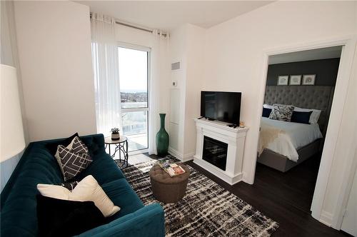 55 Speers Road|Unit #1405, Oakville, ON - Indoor Photo Showing Living Room With Fireplace