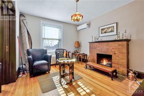 1031 Carling Avenue, Ottawa, ON - Indoor Photo Showing Living Room With Fireplace