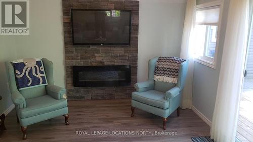 24 13Th Street N, Wasaga Beach, ON - Indoor Photo Showing Living Room With Fireplace